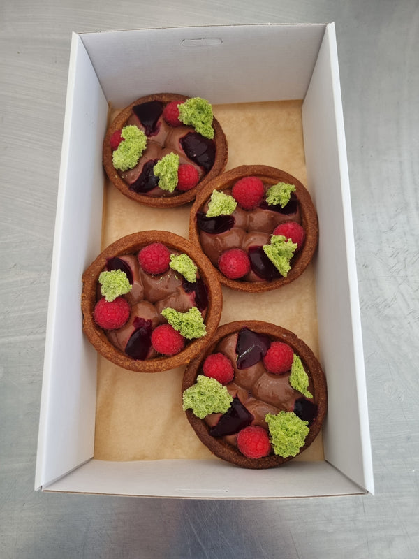 chocolate tart with raspberry, green sponge, chocolate meringue